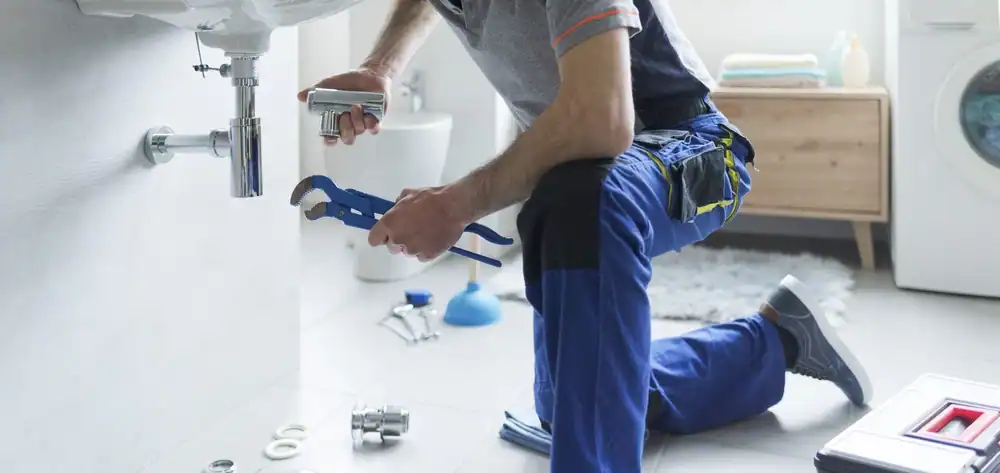 FloTek Plumbing team performing plumbing repairs and installations. Expert technicians are shown fixing pipes, installing fixtures, and using professional plumbing tools in residential and commercial settings. The image conveys reliable, affordable plumbing services with skilled staff ensuring proper installation and maintenance.